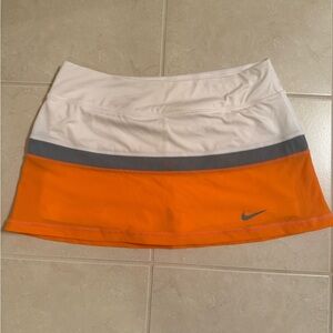 Nike tennis/golf skirt/skort with spandex- medium- orange white and grey